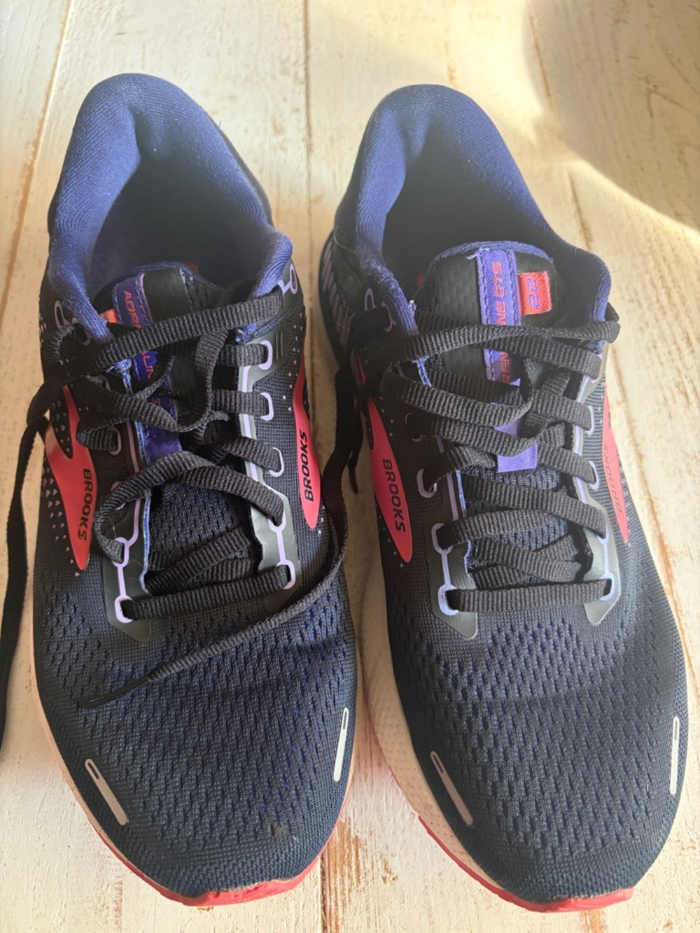 Brooks women’s Black Running Shoes with Purple Lining and Red Accents